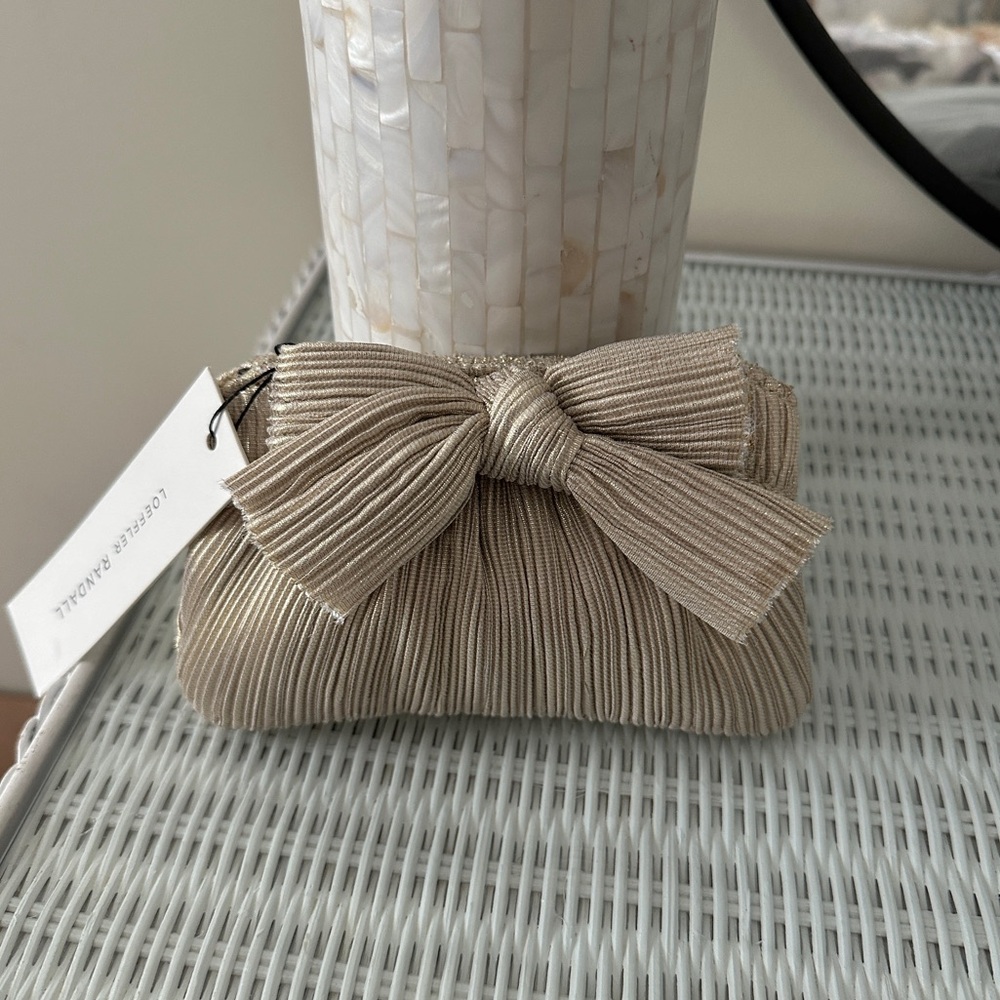 Loeffler Randall Mini Clutch, Pleated with Bow detail, Platinum color.